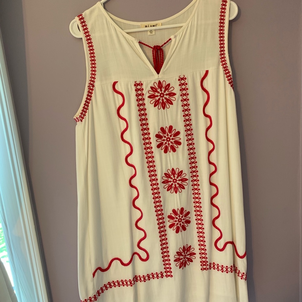 white and pink detailed dress.